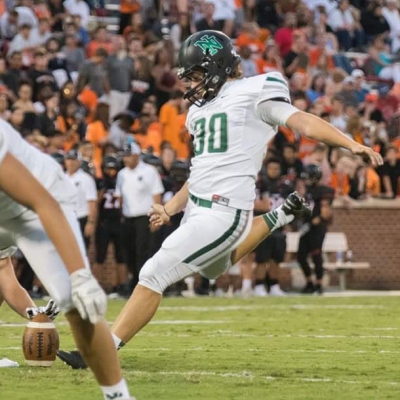 Jackson kicking a field goal for Norman North